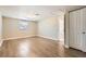 Bright bedroom with wood-look floors and neutral walls at 4404 Terry Loop, New Port Richey, FL 34652