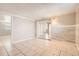 Bright dining area with wood-look wall and tile floors at 4404 Terry Loop, New Port Richey, FL 34652