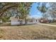 Charming ranch house with mature trees and a spacious yard at 4404 Terry Loop, New Port Richey, FL 34652