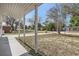 Covered porch offering views of a quiet street and neighborhood at 4404 Terry Loop, New Port Richey, FL 34652