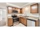 Updated kitchen with stainless steel appliances and light wood cabinets at 4404 Terry Loop, New Port Richey, FL 34652