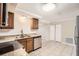 Updated kitchen with stainless steel appliances and light wood cabinets at 4404 Terry Loop, New Port Richey, FL 34652
