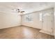 Living room with white brick wall and wood-look floors at 4404 Terry Loop, New Port Richey, FL 34652
