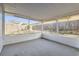 Screened porch overlooking backyard with wooden fence at 4404 Terry Loop, New Port Richey, FL 34652