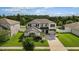 Two-story house with a landscaped yard and driveway at 12211 Streambed Dr, Riverview, FL 33579