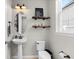 Charming powder room with pedestal sink at 12211 Streambed Dr, Riverview, FL 33579