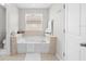 Relaxing bathroom featuring a soaking tub at 12211 Streambed Dr, Riverview, FL 33579