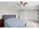 Spacious bedroom with a queen bed and ceiling fan at 12211 Streambed Dr, Riverview, FL 33579
