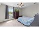 Bedroom with a double bed, dresser, and window at 12211 Streambed Dr, Riverview, FL 33579