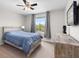 Spacious bedroom with a rustic bed frame at 12211 Streambed Dr, Riverview, FL 33579