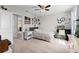 Cozy bedroom with a comfortable bed, a workspace, and a view of another room at 12211 Streambed Dr, Riverview, FL 33579