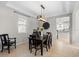Spacious dining area with a large table, six chairs, and a view into the kitchen at 12211 Streambed Dr, Riverview, FL 33579