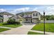 Two-story house with a large front yard and driveway at 12211 Streambed Dr, Riverview, FL 33579