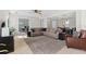Spacious living room with sectional sofa and large TV at 12211 Streambed Dr, Riverview, FL 33579