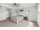 Main bedroom with king bed and access to bathroom at 12211 Streambed Dr, Riverview, FL 33579