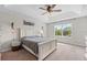 Large main bedroom with a king-size bed and ceiling fan at 12211 Streambed Dr, Riverview, FL 33579