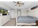 King-size bed, dresser, and TV in this main bedroom at 12211 Streambed Dr, Riverview, FL 33579