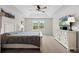 Main bedroom with king bed, dresser, and large window at 12211 Streambed Dr, Riverview, FL 33579