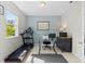 Home office with treadmill, desk, and window at 12211 Streambed Dr, Riverview, FL 33579