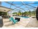 Lush pool area with patio furniture and fire pit at 12211 Streambed Dr, Riverview, FL 33579