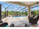 Relaxing pool and patio with wicker furniture at 12211 Streambed Dr, Riverview, FL 33579
