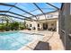 Relaxing pool area with covered patio and seating at 12211 Streambed Dr, Riverview, FL 33579