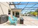 Screened pool and patio with fire pit and seating at 12211 Streambed Dr, Riverview, FL 33579