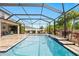 Spacious pool with a screened enclosure and patio at 12211 Streambed Dr, Riverview, FL 33579