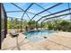 Resort-style pool with a covered patio and lush landscaping at 12211 Streambed Dr, Riverview, FL 33579