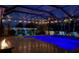 Relaxing pool and patio area with string lights and fire pit at 12211 Streambed Dr, Riverview, FL 33579