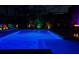 Inviting pool area with blue lighting, creating a relaxing nighttime ambiance at 12211 Streambed Dr, Riverview, FL 33579