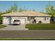 Single-story home with two-car garage and landscaped lawn at 49 Mark Twain Ln, Rotonda West, FL 33947