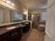 Spacious bathroom features double sinks, a glass-enclosed shower and tile flooring at 1570 Fox Grape Loop, Lutz, FL 33558