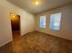 Empty dining room with tile floors and a large window offering abundant natural light at 1570 Fox Grape Loop, Lutz, FL 33558