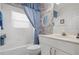 Simple bathroom with a tub and shower at 5923 Sandstone Ave, Sarasota, FL 34243