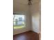 Inviting bedroom with a window for natural light and hardwood-style floors throughout at 5923 Sandstone Ave, Sarasota, FL 34243
