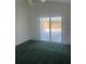 Bedroom with sliding glass doors leading to backyard pool at 5923 Sandstone Ave, Sarasota, FL 34243