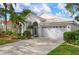 Charming single-story home with well-manicured landscaping and a two-car garage at 5923 Sandstone Ave, Sarasota, FL 34243