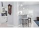 Bright kitchen area with white cabinets, a breakfast bar with seating, and stainless steel appliances at 5923 Sandstone Ave, Sarasota, FL 34243