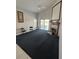 Spacious living room with fireplace and access to outdoor patio and water view at 5923 Sandstone Ave, Sarasota, FL 34243