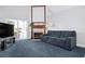 Living room with fireplace, sliding glass doors, and blue carpet at 5923 Sandstone Ave, Sarasota, FL 34243