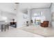 Bright and airy living area with a view to the kitchen and patio at 5923 Sandstone Ave, Sarasota, FL 34243
