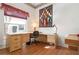 Home office with L-shaped desk and window at 5923 Sandstone Ave, Sarasota, FL 34243