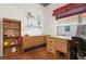 Home office with wooden desk and built-ins at 5923 Sandstone Ave, Sarasota, FL 34243