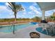 Pool area with patio furniture and fire pit at 5923 Sandstone Ave, Sarasota, FL 34243