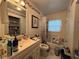 Clean bathroom with a bathtub, toilet and vanity at 6002 Town N Country Blvd, Tampa, FL 33615