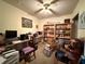 Home office with a desk, chair, and bookshelves at 6002 Town N Country Blvd, Tampa, FL 33615