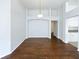 Simple dining room with hardwood floors and kitchen access at 34434 Windknob Ct, Wesley Chapel, FL 33545