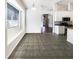 Bright dining room with tile floors and view of kitchen at 34434 Windknob Ct, Wesley Chapel, FL 33545
