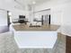Modern kitchen with white cabinets, stainless steel appliances, and an island at 34434 Windknob Ct, Wesley Chapel, FL 33545